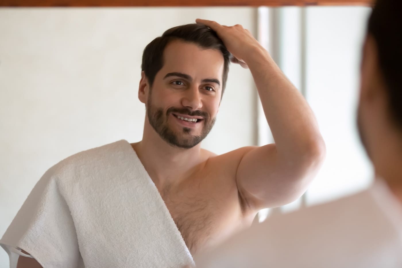 Man with strong, healthy hair highlighting benefits of Procell Hair Restoration at Rejuv Head Spa California.